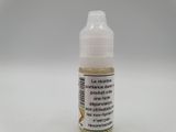a close up of a bottle of liquid on a white surface