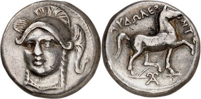 a silver coin with an image of a man on a horse