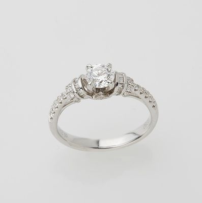 an engagement ring with a diamond center stone set in white gold