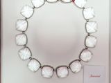 an image of a bracelet with white stones in a box