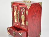a small wooden cabinet with a drawer in it