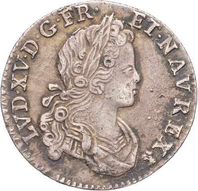 gros plan d'une pièce de monnaie sur laquelle figure une tête de femme