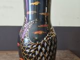 a vase that is sitting on a wooden table