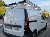 a white van that is parked on the side of the street