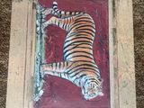 a picture of a painting of a tiger on the wall