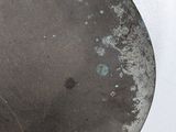 an old fry pan with a spatula on it