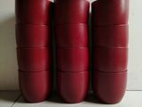 six red cups are stacked on top of each other on a table