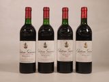 trois bouteilles de vin rouge sont alignées sur une table