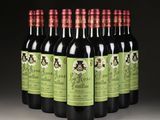 six bottles of red wine are lined up in a row