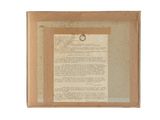 a close up of a piece of paper with a ring on it