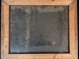 an old wooden frame with a chalkboard in the middle