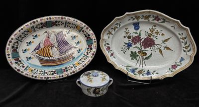 two plates and a cup on a black table