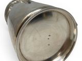 an image of a metal object on a white surface