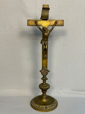 a cross on a stand with a crucif on it