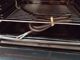 a wire in the oven that is connected to a cord
