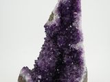 a close up of a piece of amethorate on a white surface