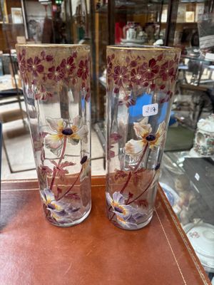 two vases that are sitting on a table