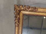 a mirror that is sitting on the wall in the room