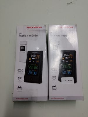 packaging of two electronic devices sitting on top of a white table