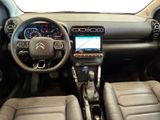 the interior of a car with a steering wheel, dashboard, and dash board