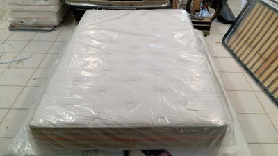 a mattress that is sitting on the floor in a room