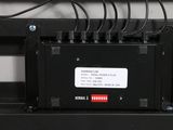 a close up of a black electronic device with wires on it