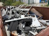 a large pile of electronic equipment in the back of a truck