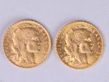 two pieces of gold coins with a woman ' s face on them