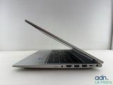 an open laptop computer sitting on top of a white table