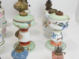 a lot of different colored vases sitting on a table