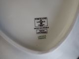 a close up of a toilet with a label on it