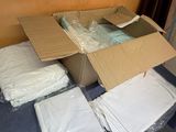 a pile of boxes and other items on the floor