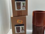 a box of candles and a candle holder on a table