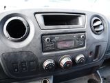 a dashboard of a car with a radio and a steering wheel