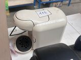 a white toilet sitting next to a box of boxes