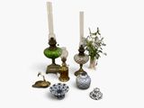 a lot of different vases and candles on the table