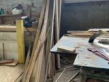 many pieces of wood sitting on the floor in a room