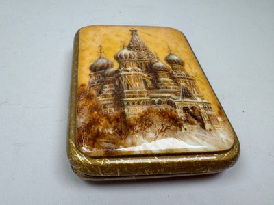 a small box with a picture of a building on it