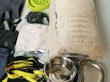 the contents of a backpack are laid out on the table