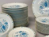 a lot of plates with blue flowers on them