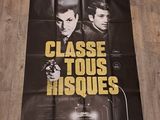 L'affiche du film culte, des films cultes, est exposée sur un parquet.