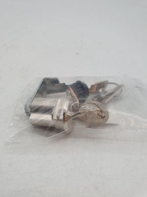 two keys in a plastic bag on a white surface