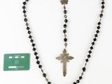 a close up of a rosary with a cross on it