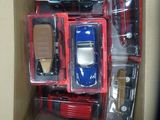 a box with a bunch of toy cars inside of it