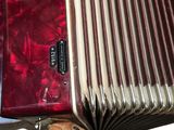an image of a close up of an accordion on a white background