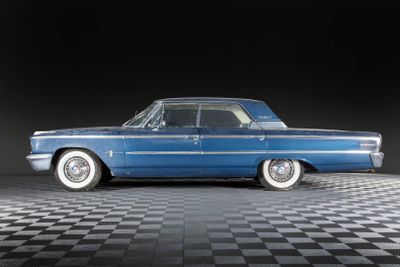 an image of a blue car on a black and white checkered floor