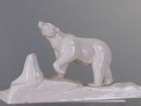 a statue of a polar bear on top of a mountain