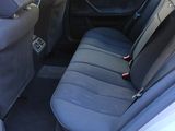the back seat of a car with the door open is shown