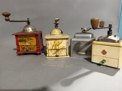three different types of coffee grinders and a coffee grinder