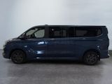 the blue van is parked in a room with a white wall